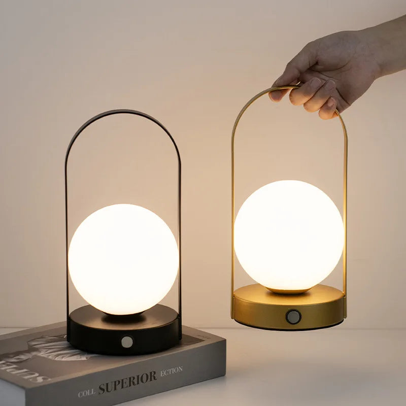 https://ae01.alicdn.com/kf/Se6b1a1af0b7649cdafdd7ba22229d6f3J/Portable-Outdoor-Hanging-Metal-Table-Lamp-Dimmable-Wireless-Table-Lamp-with-USB-Rechargeable-Bedroom-Bedside-Night.jpg